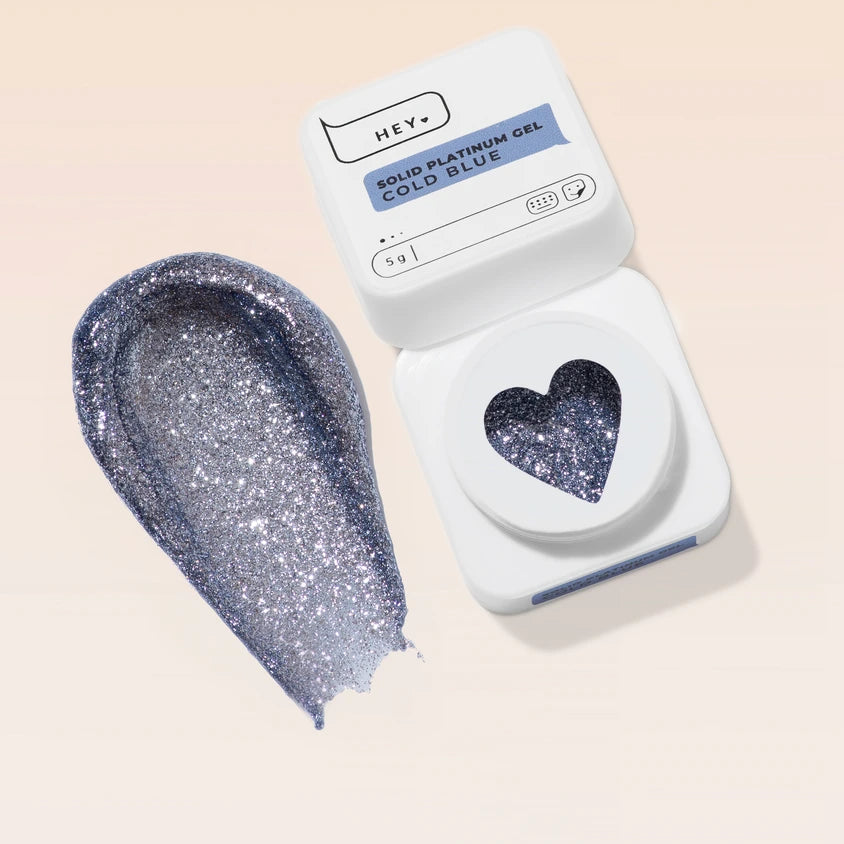 Cold blue glitter solid platinum gel nail polish in a white container with heart-shaped window