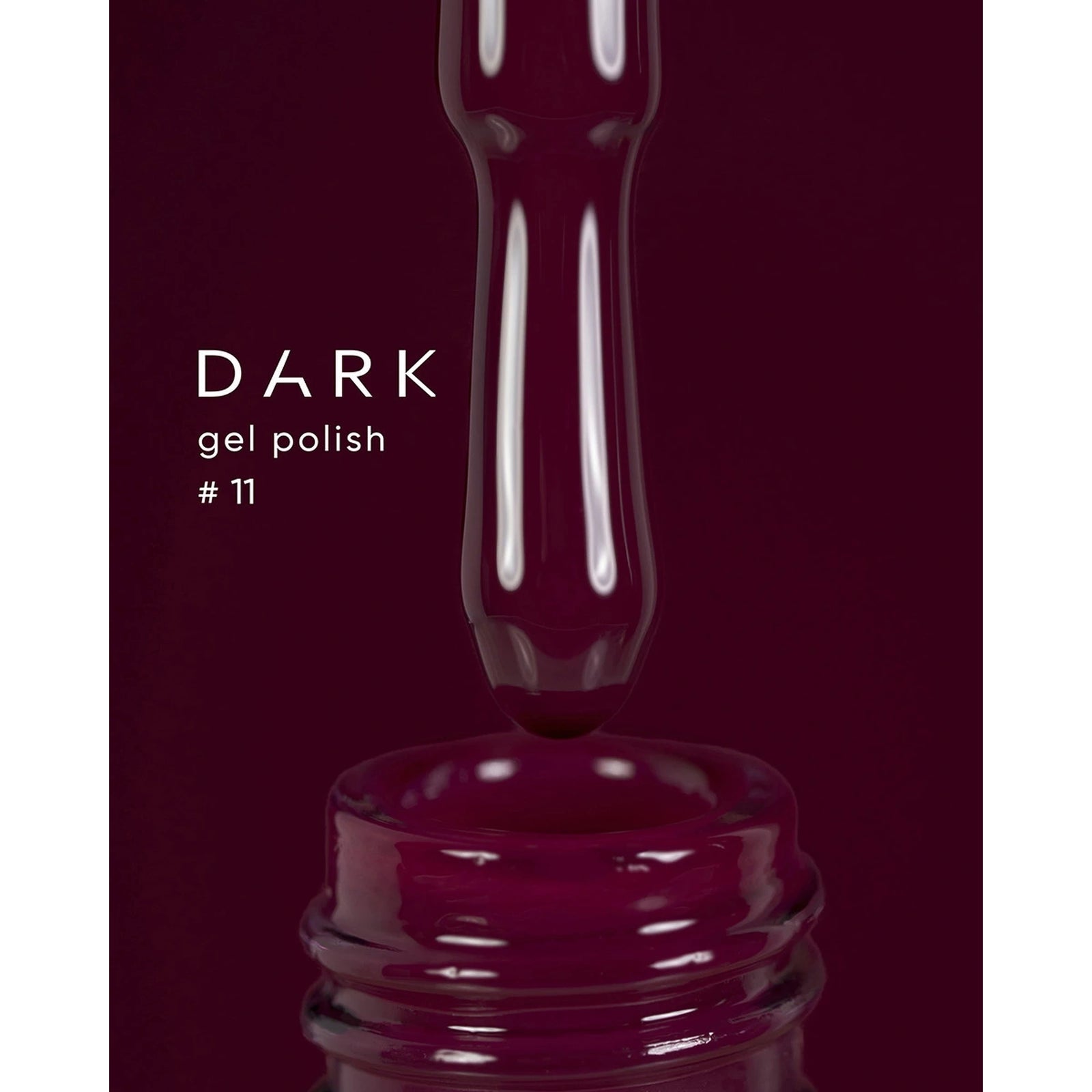 Dark burgundy gel nail polish brush over bottle, labeled gel polish #11.