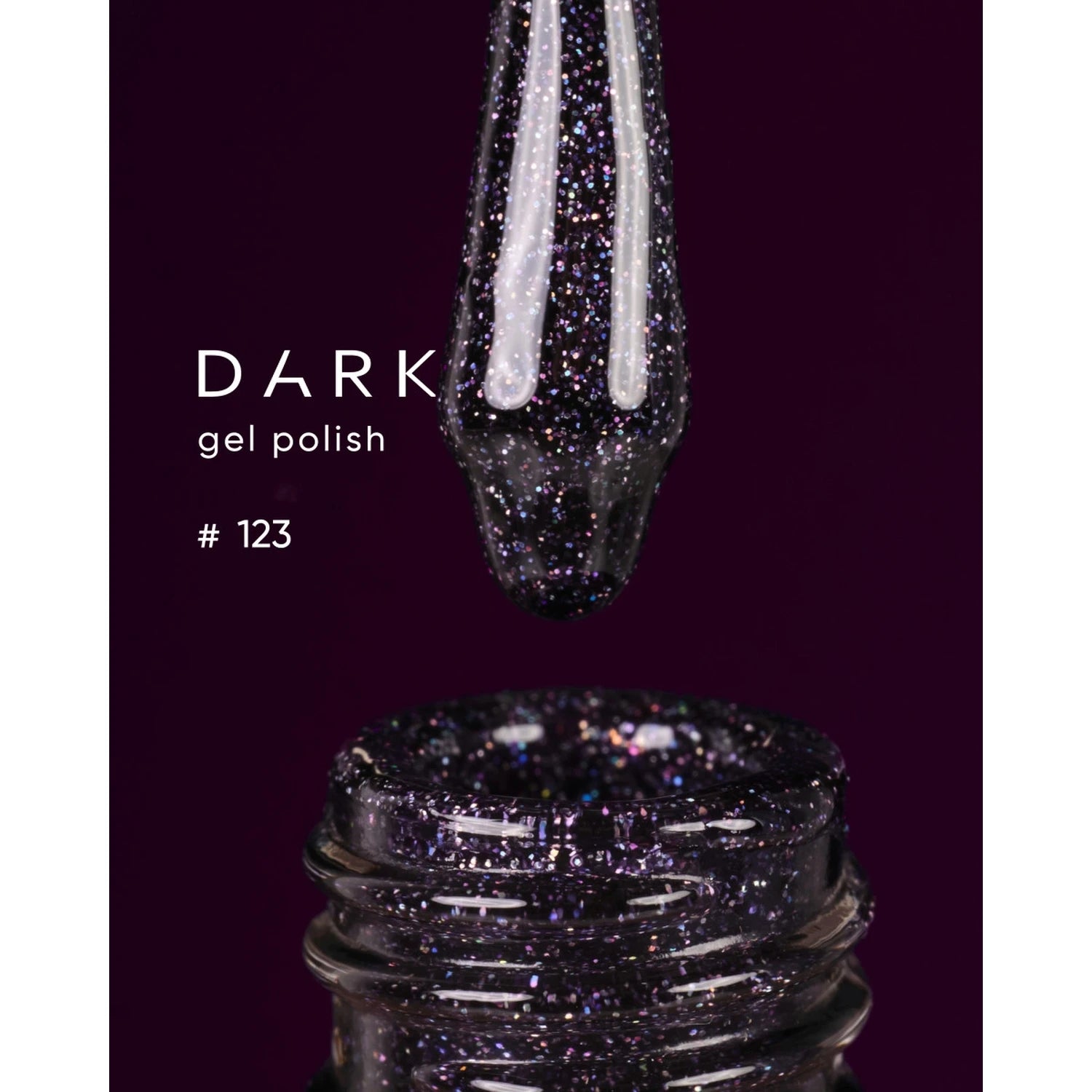 Dark glitter gel nail polish bottle and applicator, shade 123, on deep purple background
