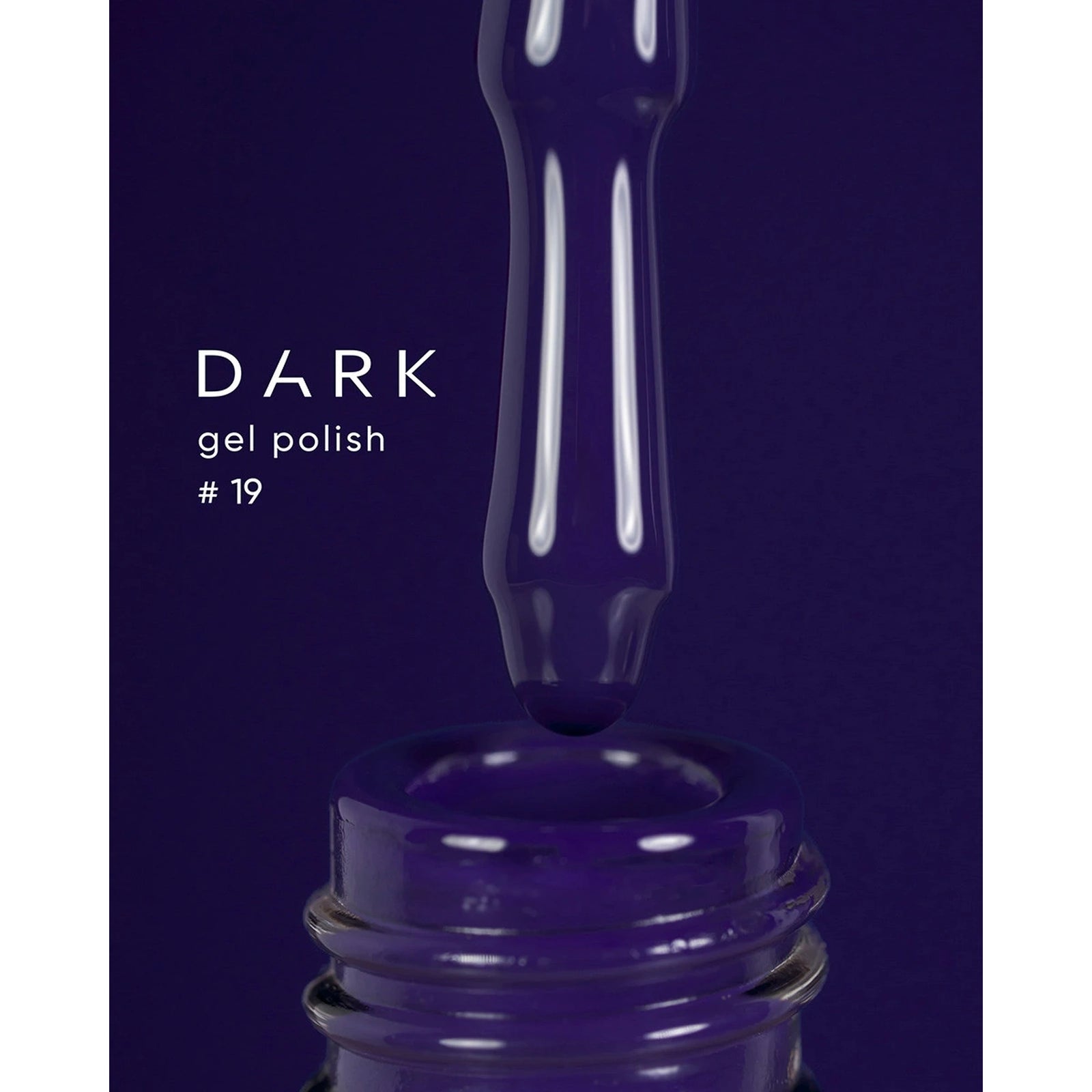 Dark gel polish number 19, deep purple nail polish dripping from a brush into a bottle