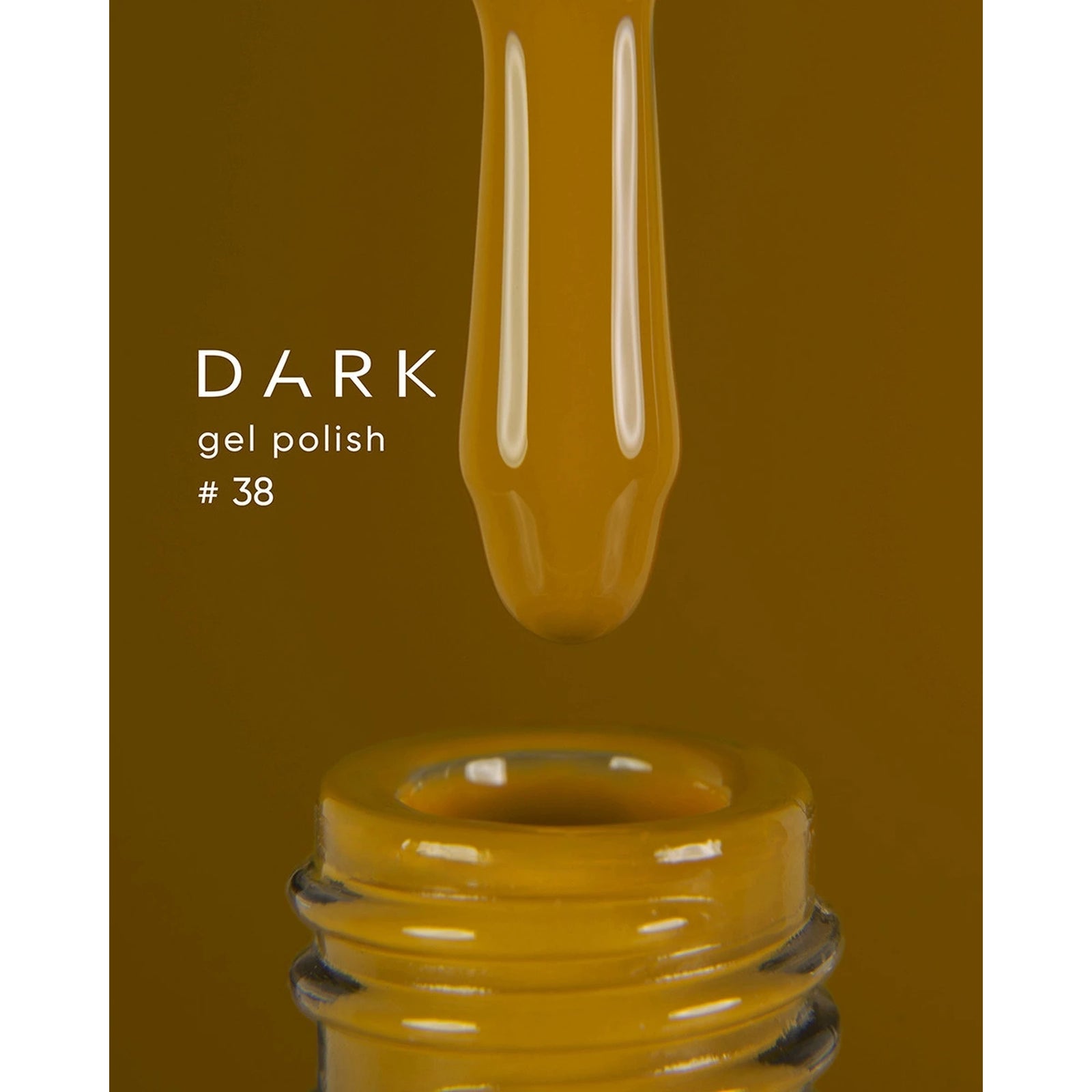 Dark yellow gel polish bottle with brush, labeled gel polish #38, nail product close-up