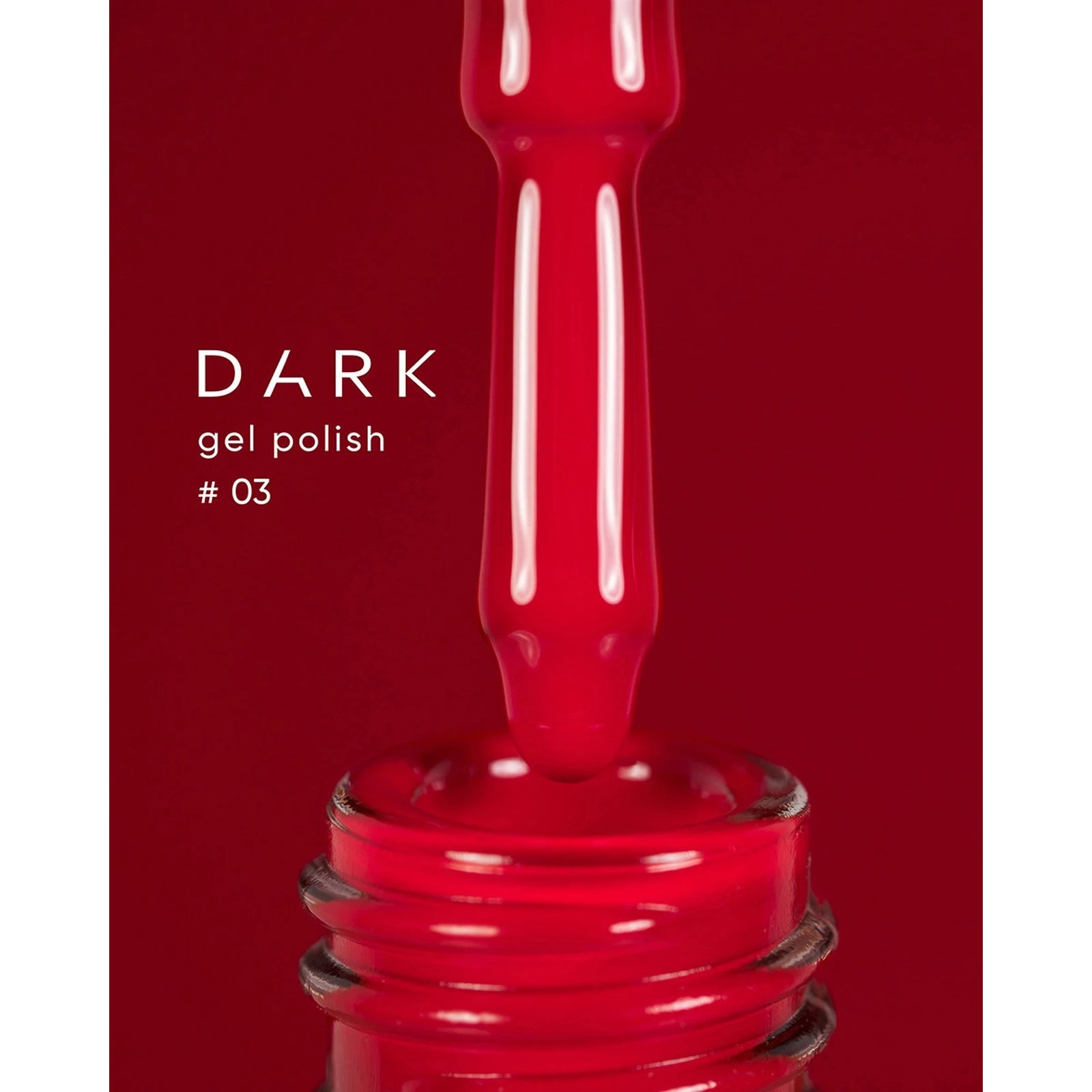 Bright red gel nail polish bottle with applicator brush, shade 03, close-up