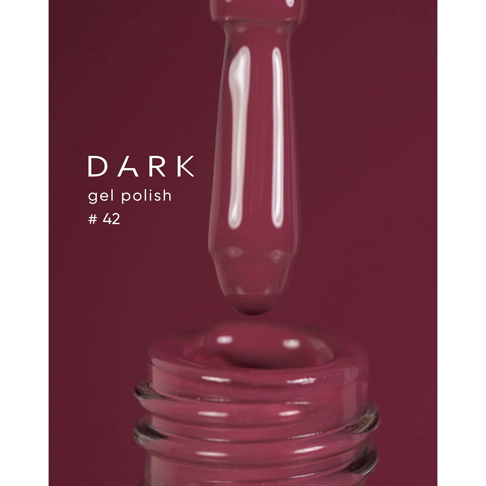 Burgundy gel nail polish number 42 with applicator brush close-up