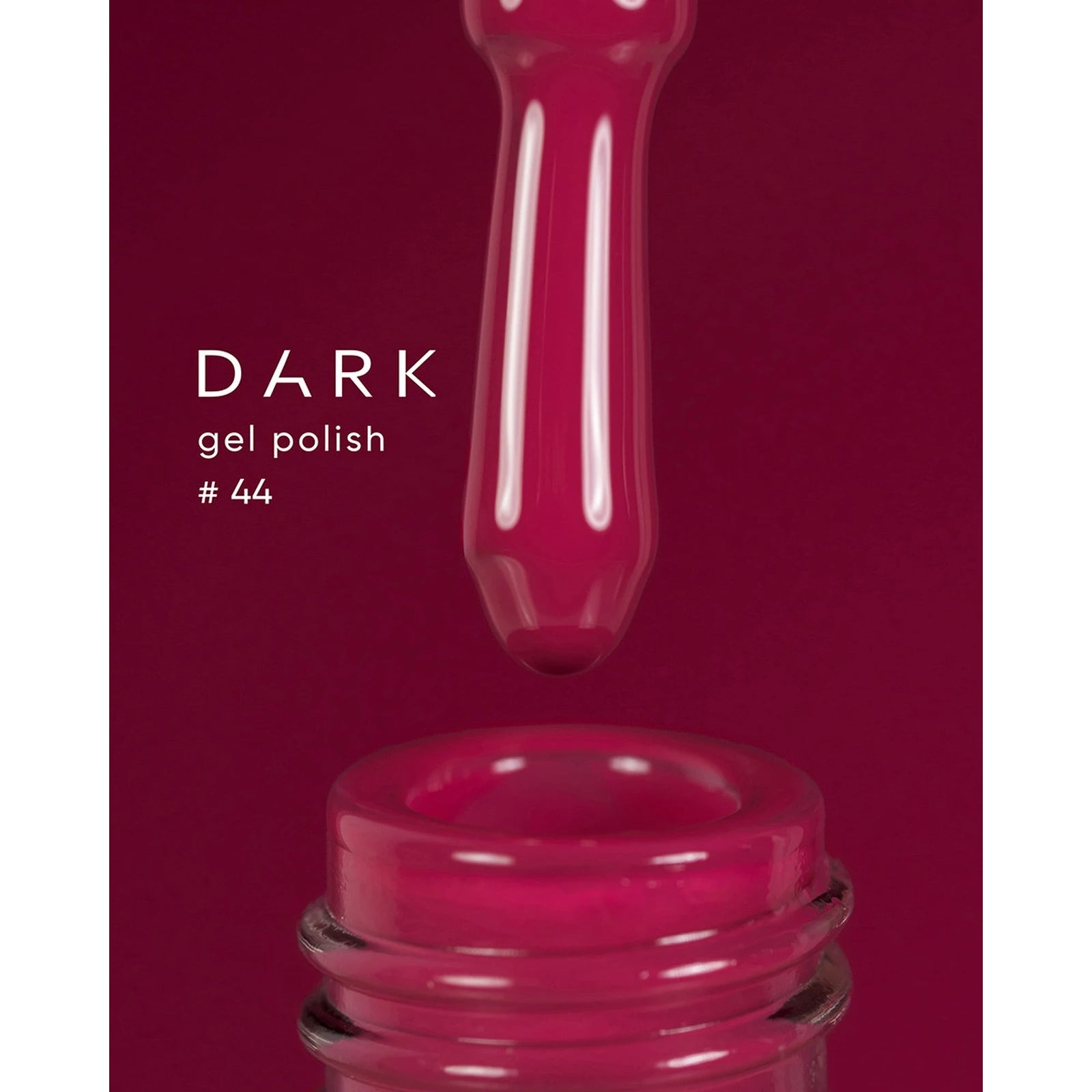 Dark burgundy gel polish bottle with brush, nail product #44, close-up