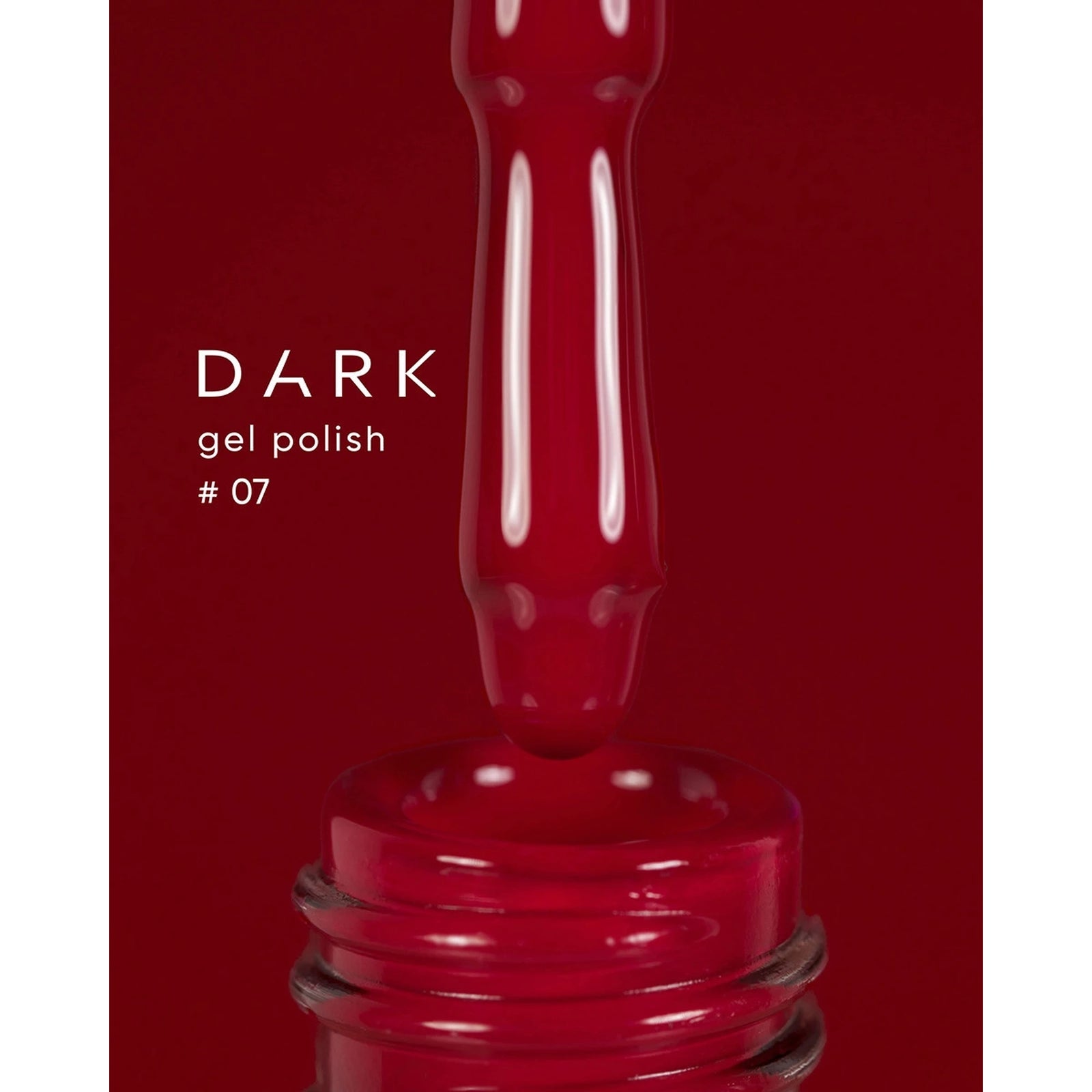 Dark gel polish #07, rich red UV gel nail polish with brush above open bottle