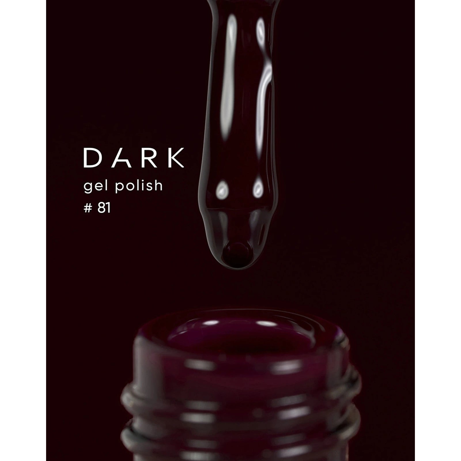 Dark gel polish #81 dripping from brush into bottle, deep burgundy nail polish closeup