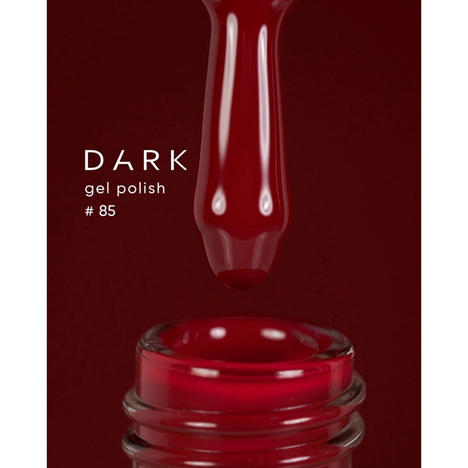 Dark burgundy gel polish brush and bottle, nail product shade 85 for manicure