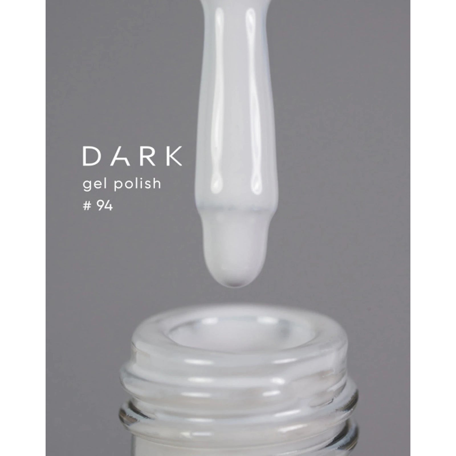 White gel polish drip above open bottle, labeled Dark gel polish #94, for manicure use