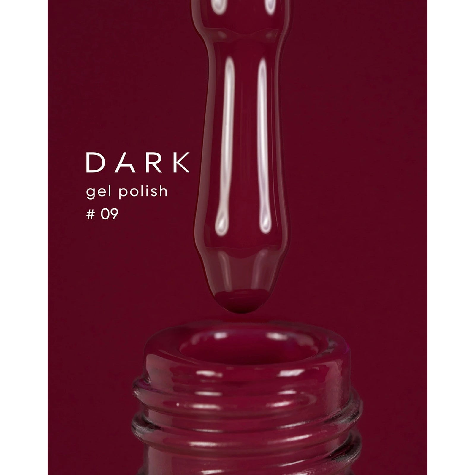 Dark gel polish number 09, deep burgundy gel dripping into open nail polish bottle