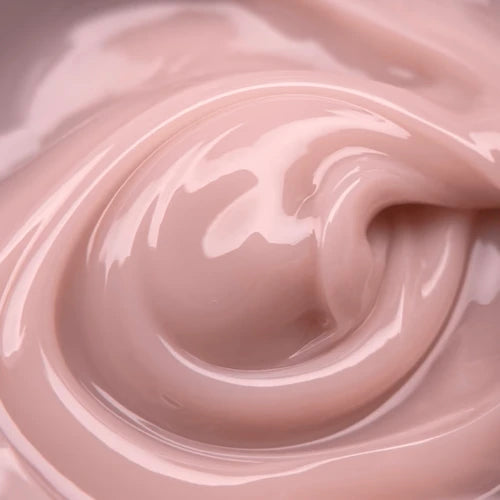 Close-up of nude pink builder gel texture for professional nail enhancement