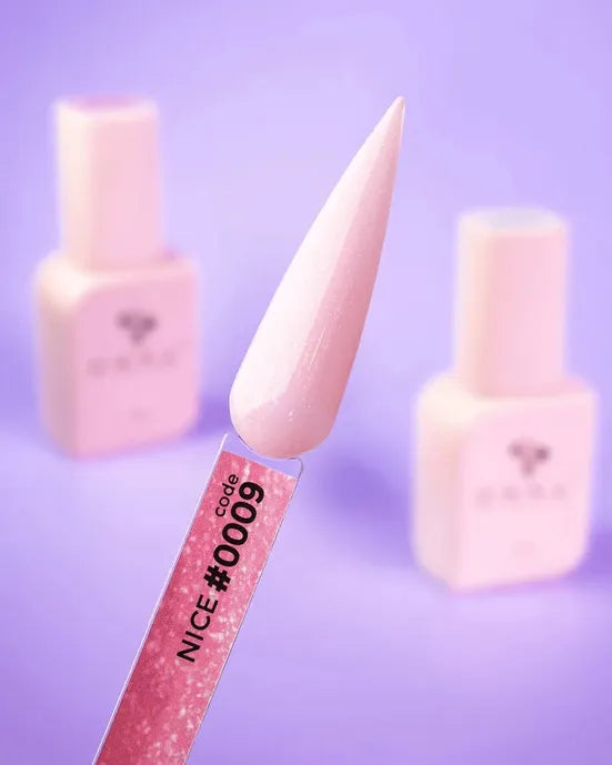 Light pink nail gel sample on swatch stick labeled #0009, two gel polish bottles in background