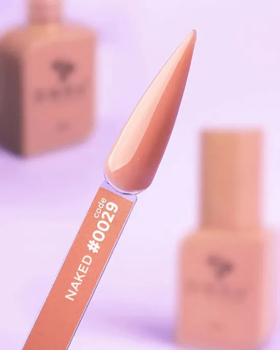 Nude gel nail polish swatch labeled code 0029, with matching bottles in background