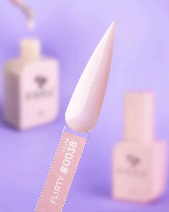 Pink nude gel nail polish swatch on display stick, labeled FLIRTY #0038, with bottles in background