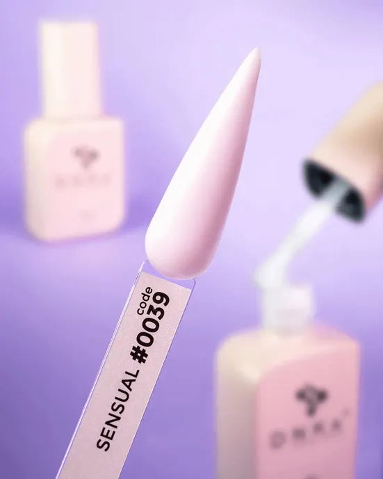 Pale pink rubber base nail polish sample labeled code 0039, with matching bottles on purple background