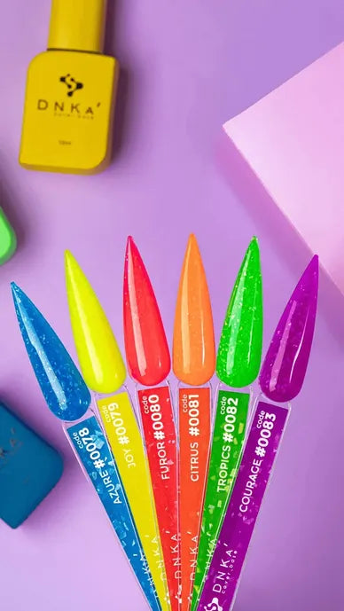 Set of colorful nail polish samples with labeled swatches on a purple background