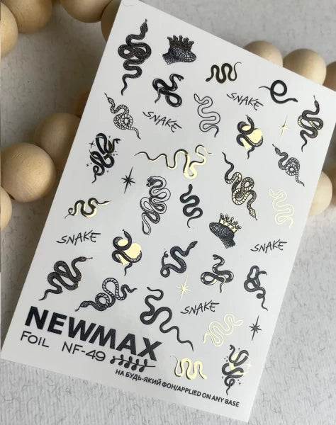 Snake and crown nail art foil stickers in black and gold, ideal for manicure designs.