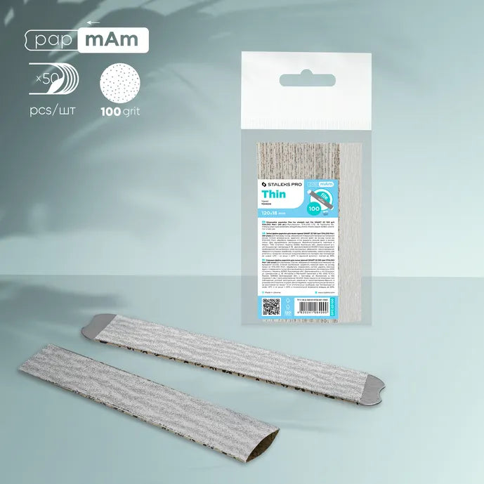 Pack of 100 grit thin nail file replacement strips and two strips on a blue background