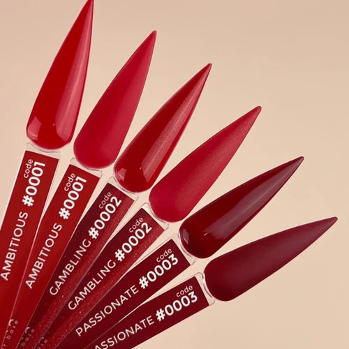 Red nail polish codes on a beige background