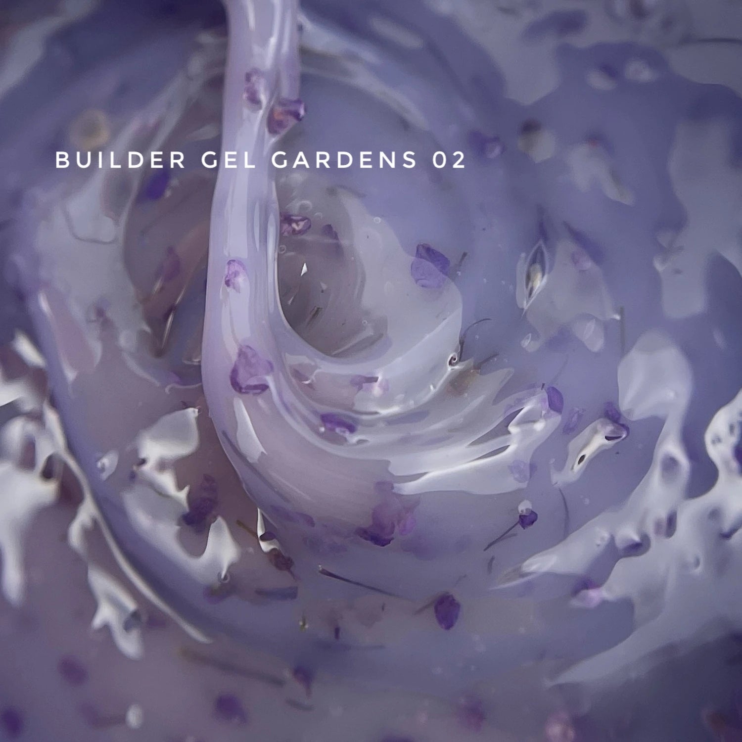 Close-up of purple builder gel with floral accents for professional nail art.