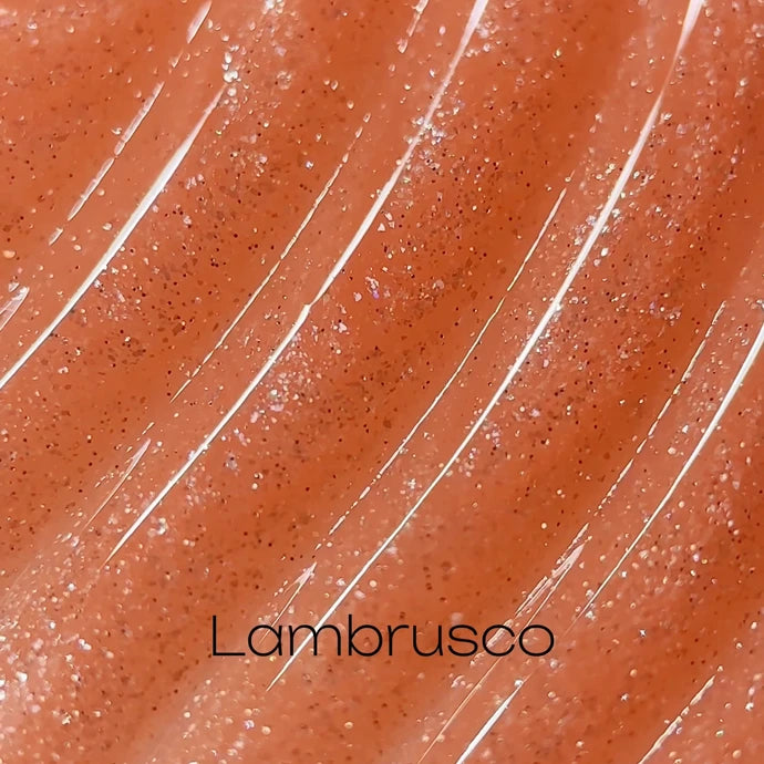 Shimmery orange-brown nail gel polish with fine glitter, labeled Lambrusco