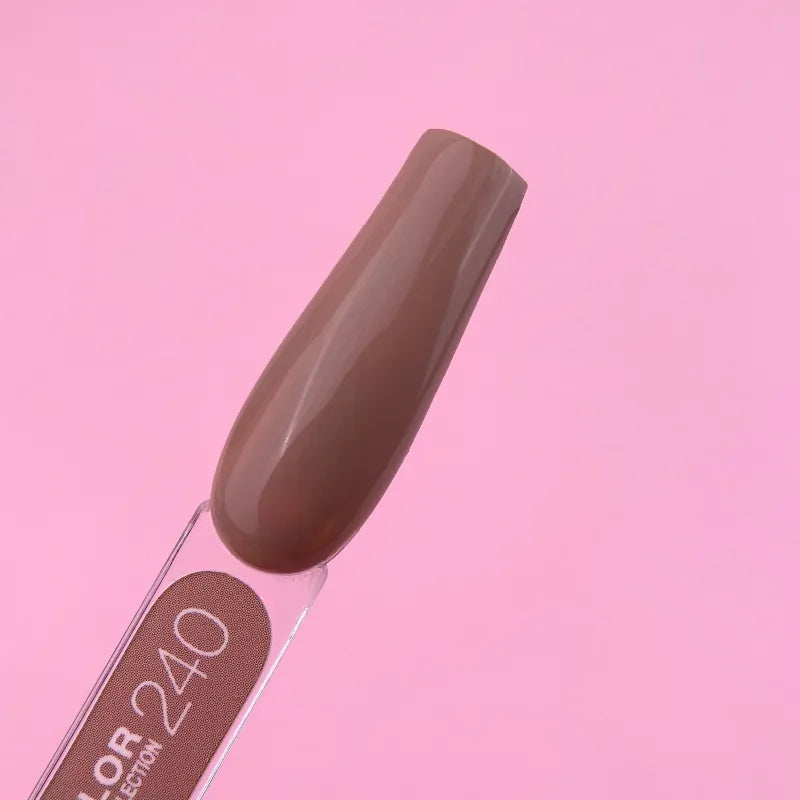 Brown nude gel nail polish color swatch on stick, manicured sample, pink background