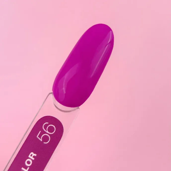 Purple gel nail polish color sample on swatch stick against pink background
