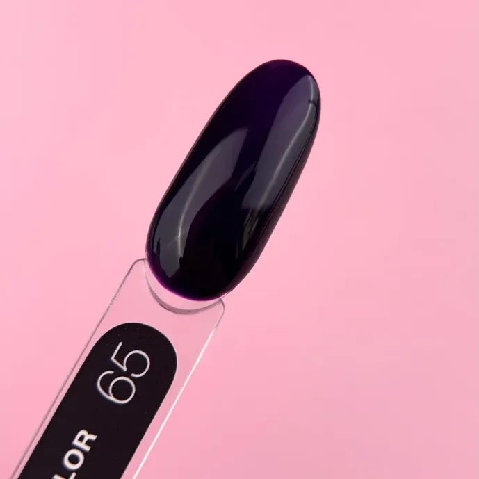 Glossy dark purple gel nail polish swatch on clear stick, pink background