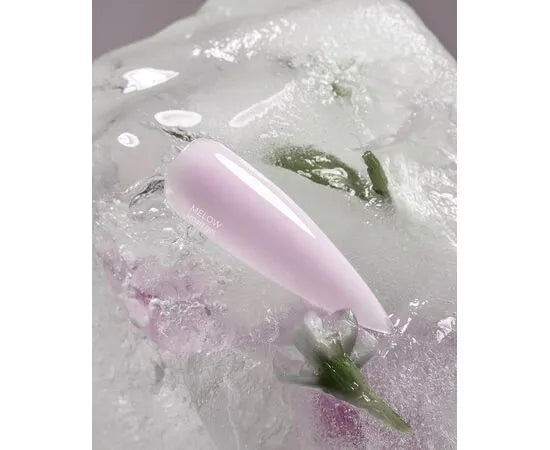 Glossy pastel pink nail tip on ice with floral accents, manicure gel polish sample