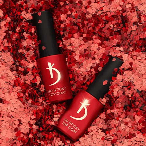 Two red nail polish bottles with black caps on a red textured background - Photo №3