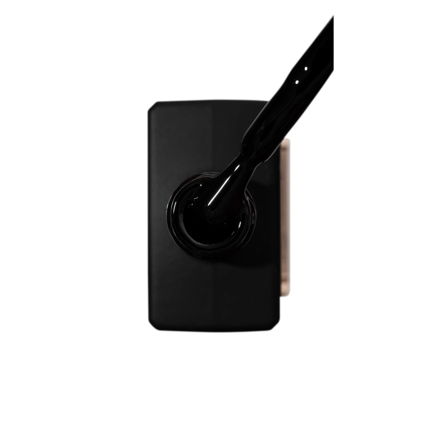 Black UV gel nail polish bottle with applicator brush, professional manicure product
