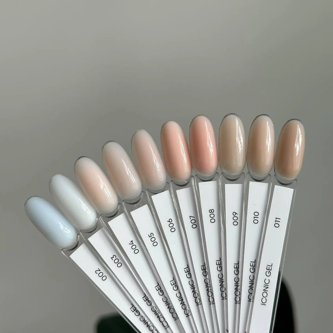 UV gel nail polish color swatches in soft pastel and nude shades for manicure