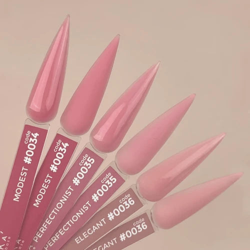 Pink stiletto nails with brand labels on a beige background