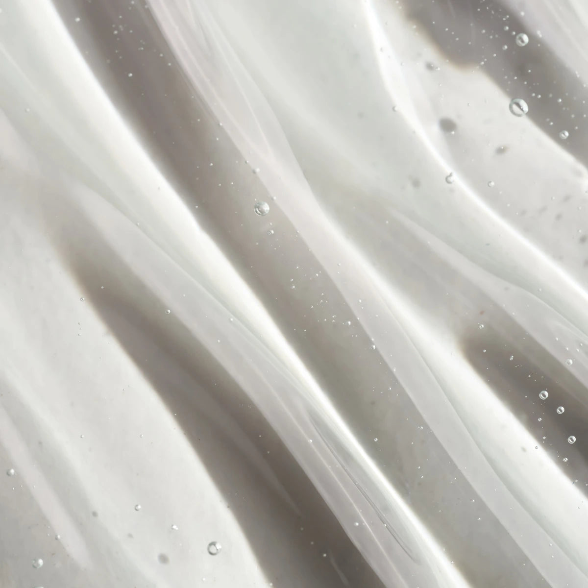 Close-up of clear UV gel texture with bubbles, ideal for professional nail art and manicures