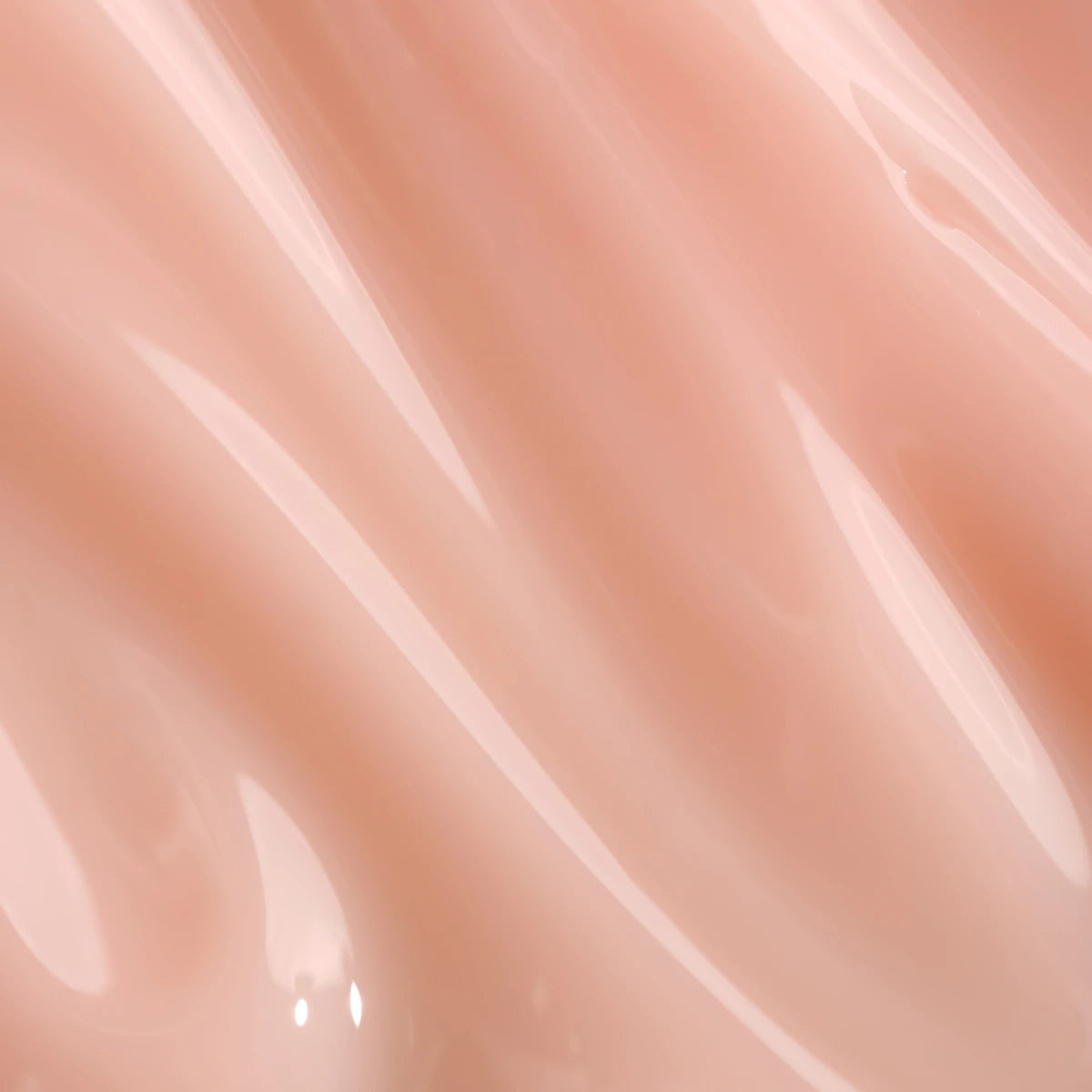 Glossy nude pink UV gel polish texture, ideal for manicures and nail art backgrounds