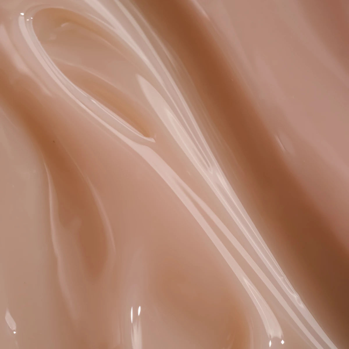 Glossy nude pink UV gel texture for professional nail manicure closeup