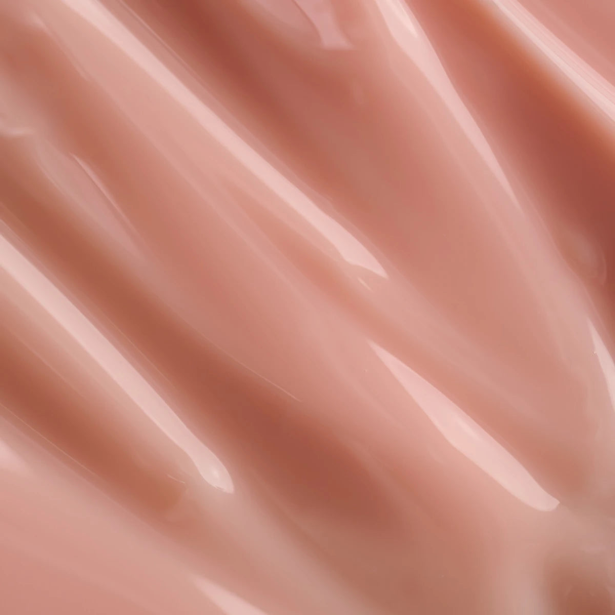 Close-up of glossy nude pink gel, ideal for manicure UV gel nail applications