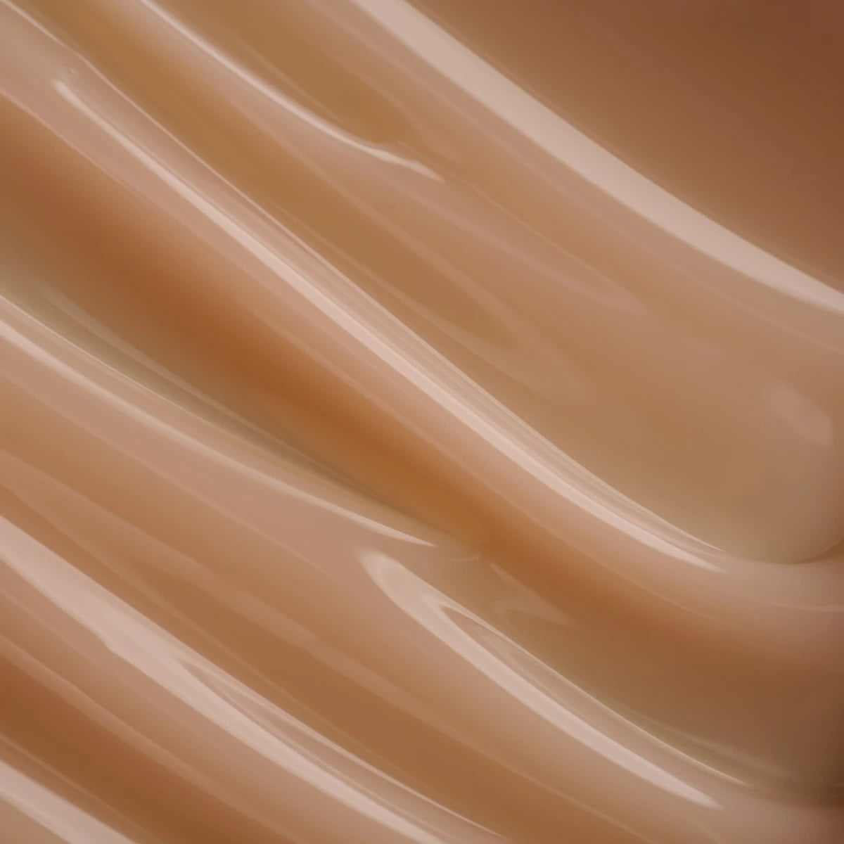 Close-up of nude pink UV gel texture for nail extensions and manicure