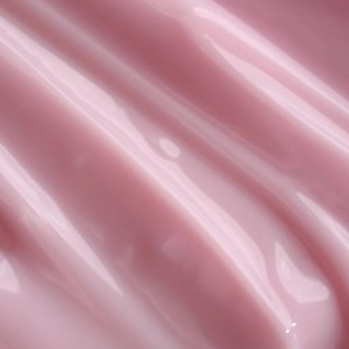 Glossy pink UV nail gel texture for professional manicure and nail art