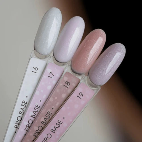 Four pastel nail polish swatches in soft shimmer shades for manicures and pedicures.