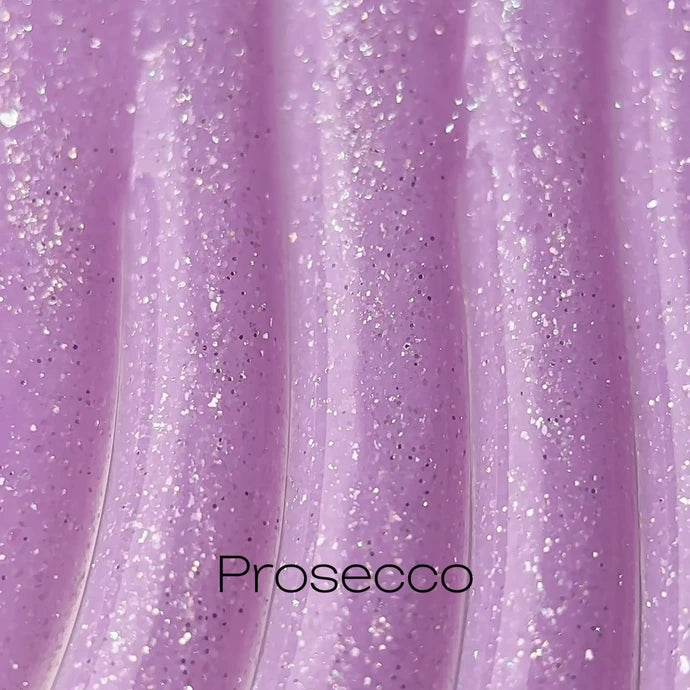 Shimmery light purple gel nail polish texture with glitter, labeled Prosecco