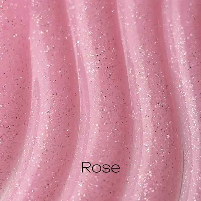 Pink glitter rose UV gel nail polish with shimmer texture, close-up swatch.