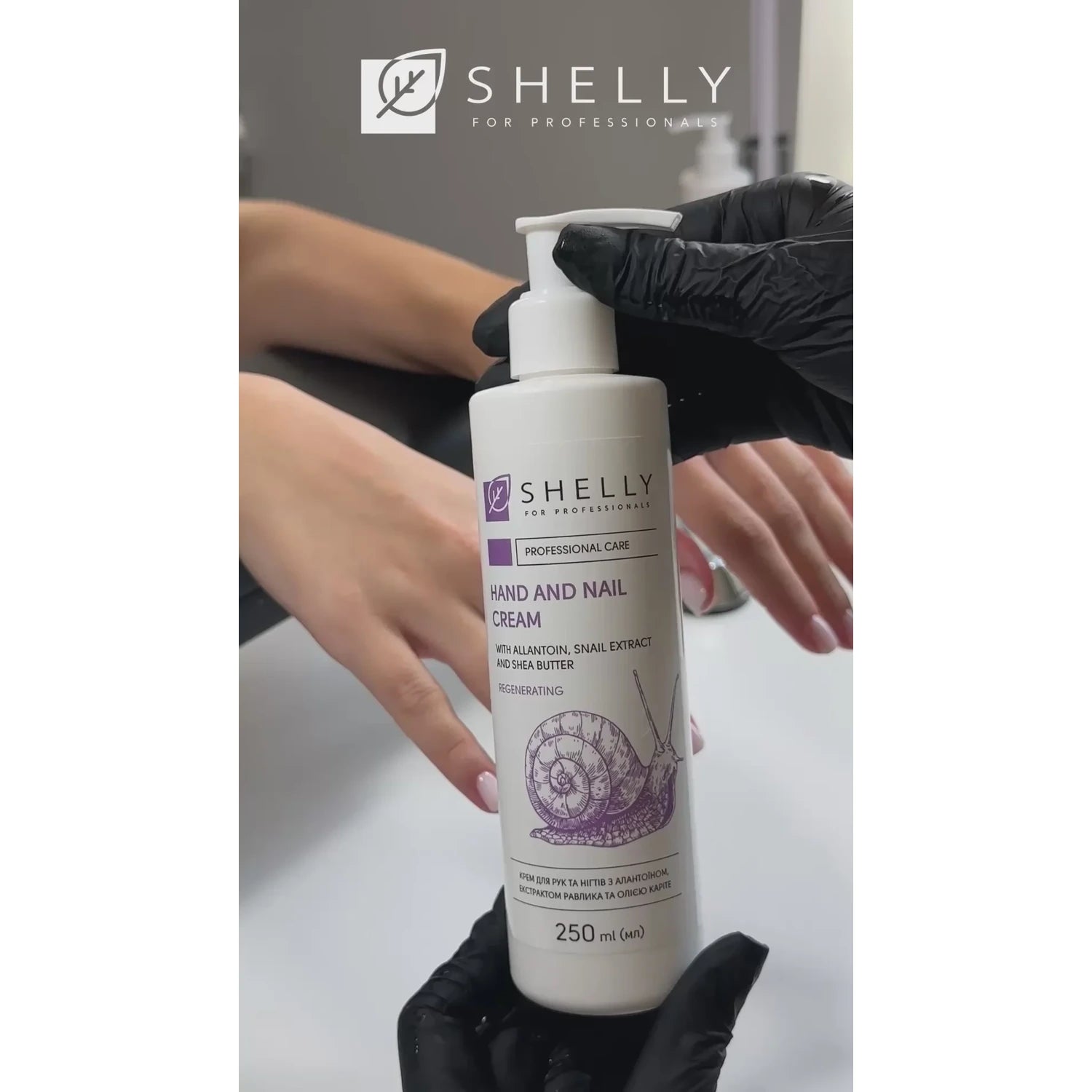 Hand and nail cream for manicure, bottle held by gloved hand near client’s manicured nails