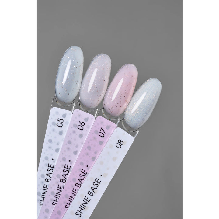 Glitter gel nail polish samples in pastel shades, labeled Shine Base 05 to 08, on gray background.