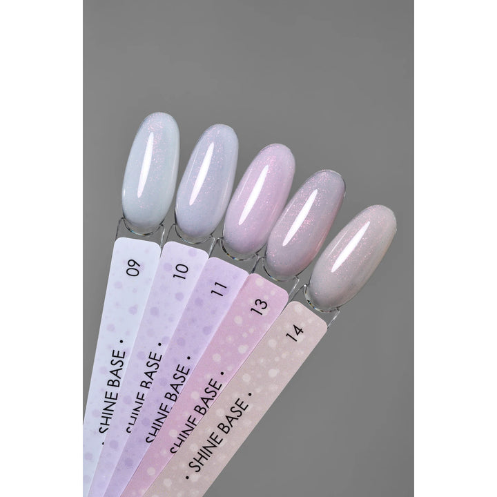 Nail polish color samples in pastel shimmer shades, labeled Shine Base 09 to 14, on gray background.