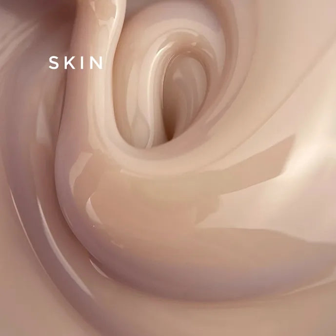 Creamy nude nail gel texture close-up, glossy swirl, labeled 'skin'