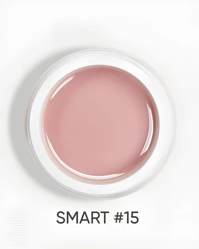 Open jar of pink UV nail gel labeled SMART #15 for professional manicure
