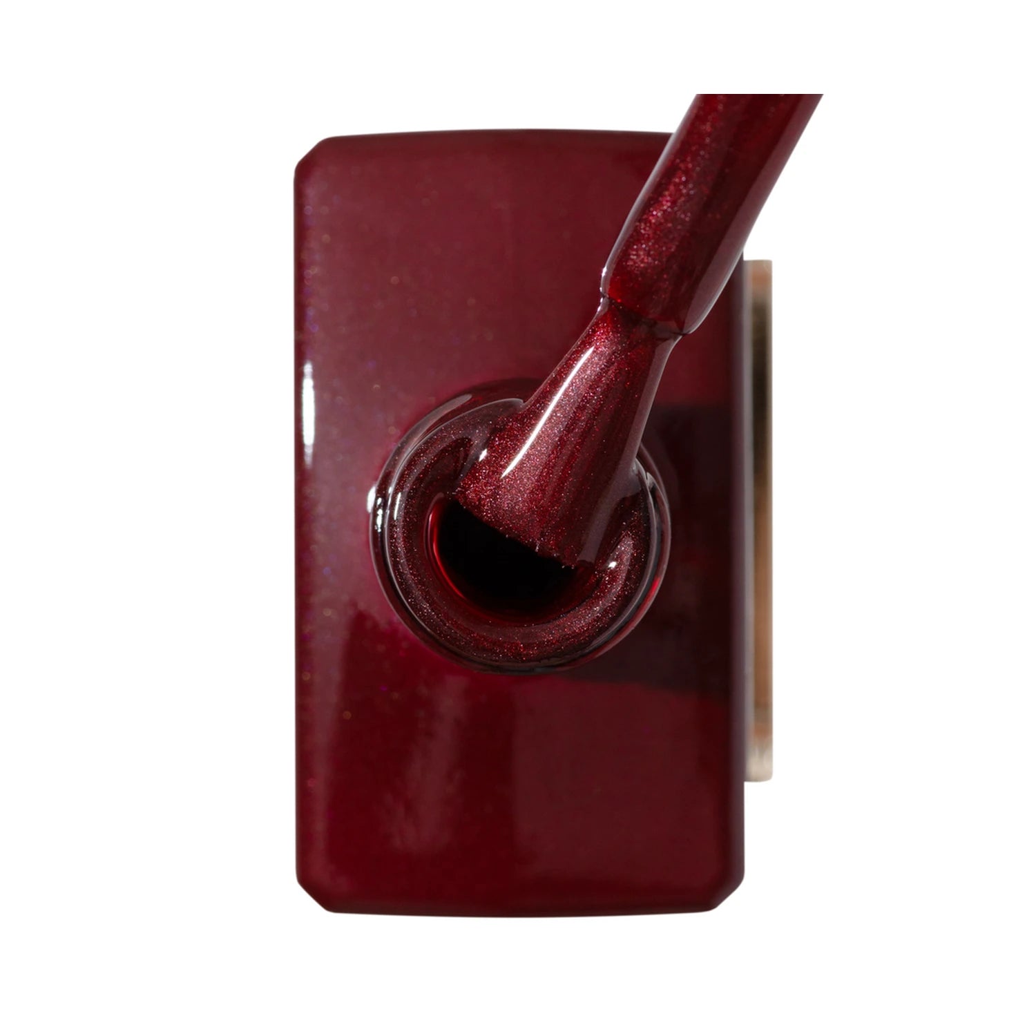Shimmery dark red gel nail polish bottle with brush applicator
