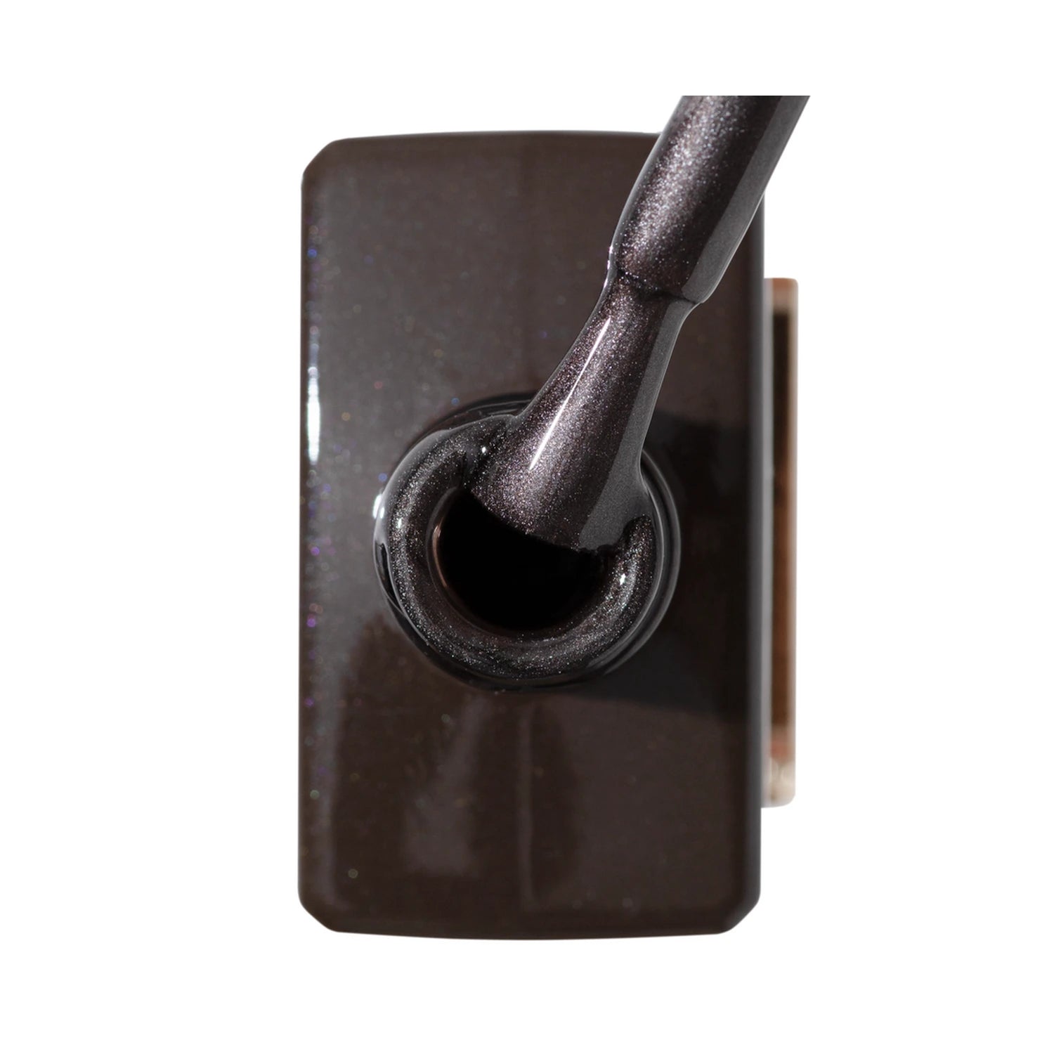 Close-up of a bottle of dark shimmery gel nail polish with applicator brush