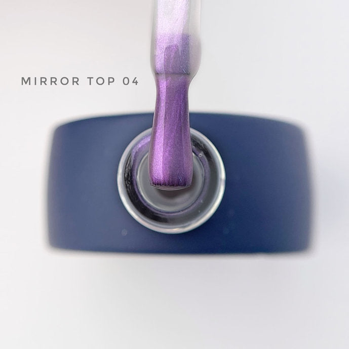 Mirror top coat 04 with iridescent purple gel polish on brush, manicure product