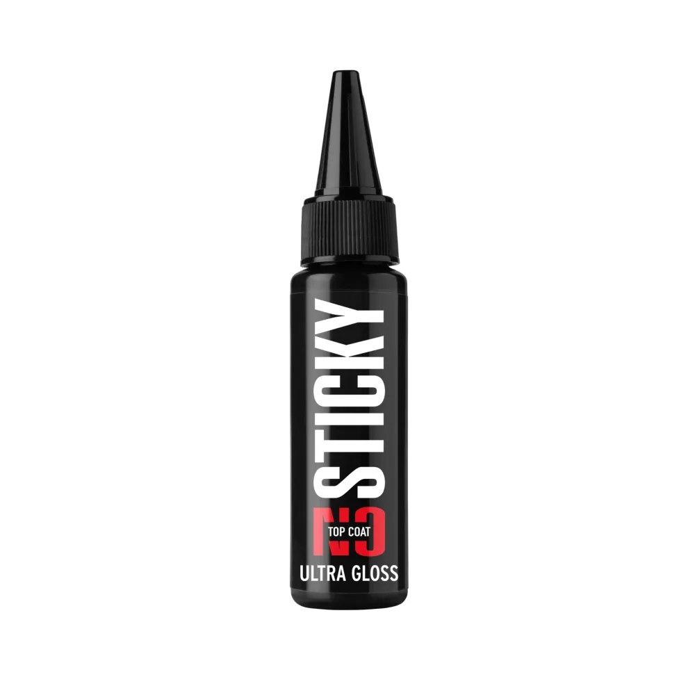 Black bottle of no sticky ultra gloss top coat for nails with pointed nozzle on white background